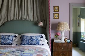 bedroom with purple walls and vintage lighting