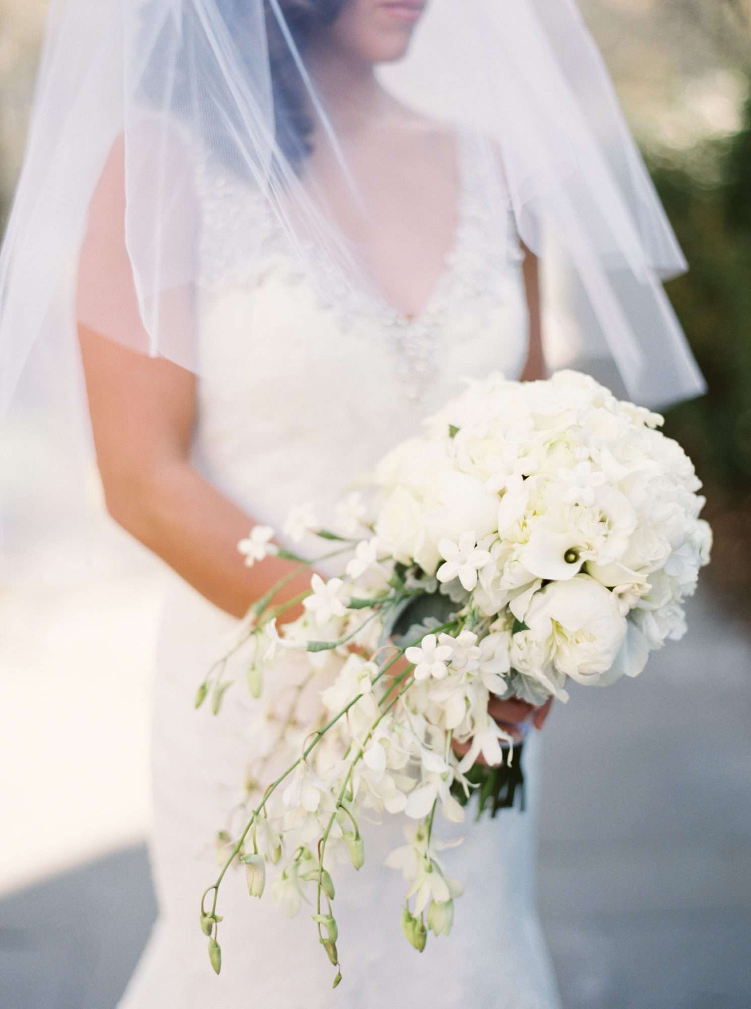 white bouquet with roses and single calla lily