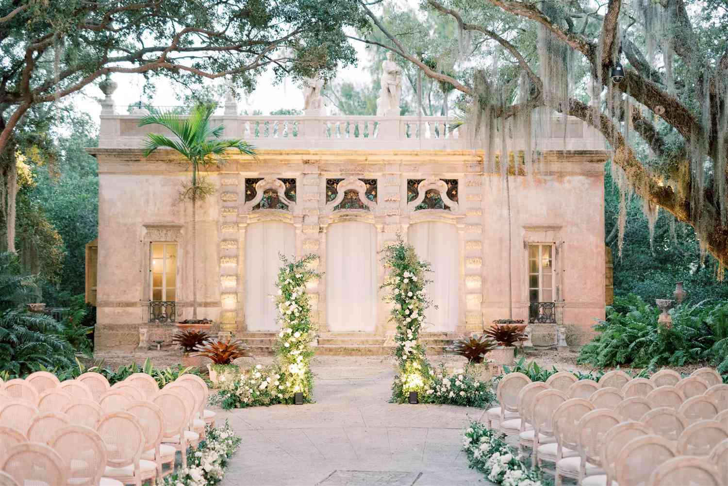 symmetrical wedding ceremony setup at vizcaya museum courtyard