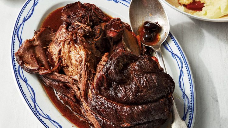 pressure cooker pot roast with dates olives and orange blue white serving tray