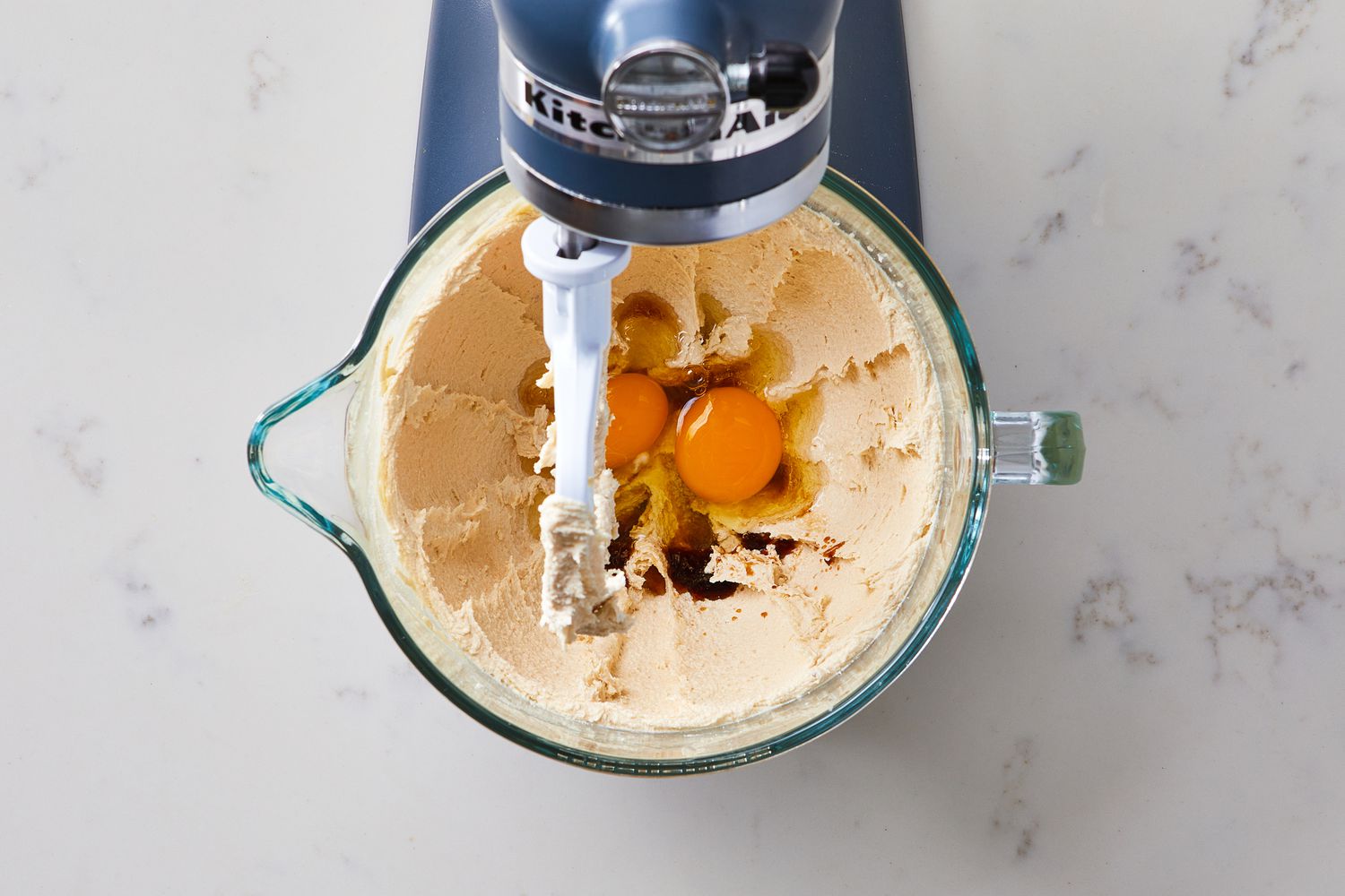 Add eggs - Step 3 of Chewy Chocolate Chip Cookies