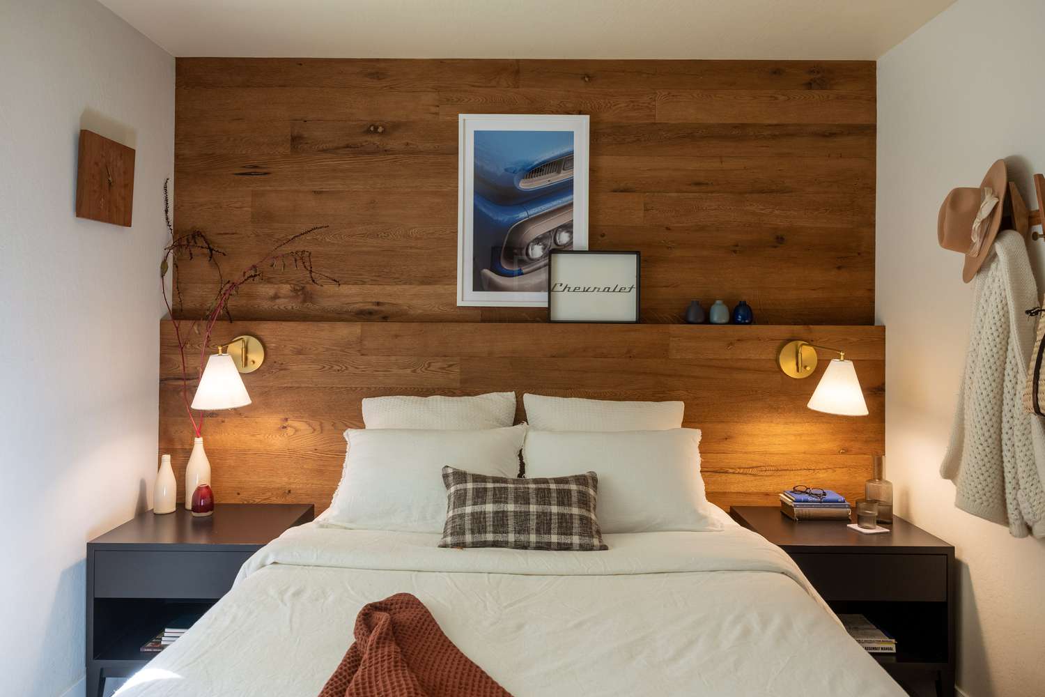 tiered wood wall paneling above bed