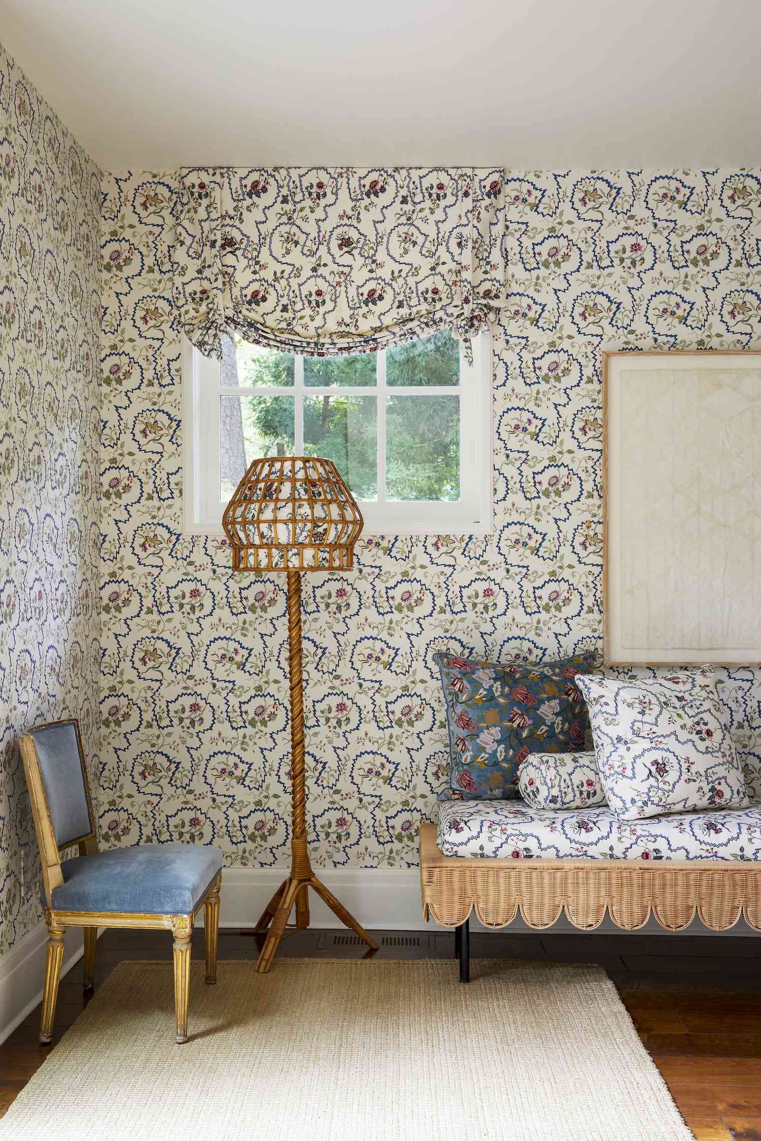 floral wallpaper with matching lamp in hallway