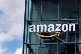 The Amazon logo displayed on a buildings glass facade
