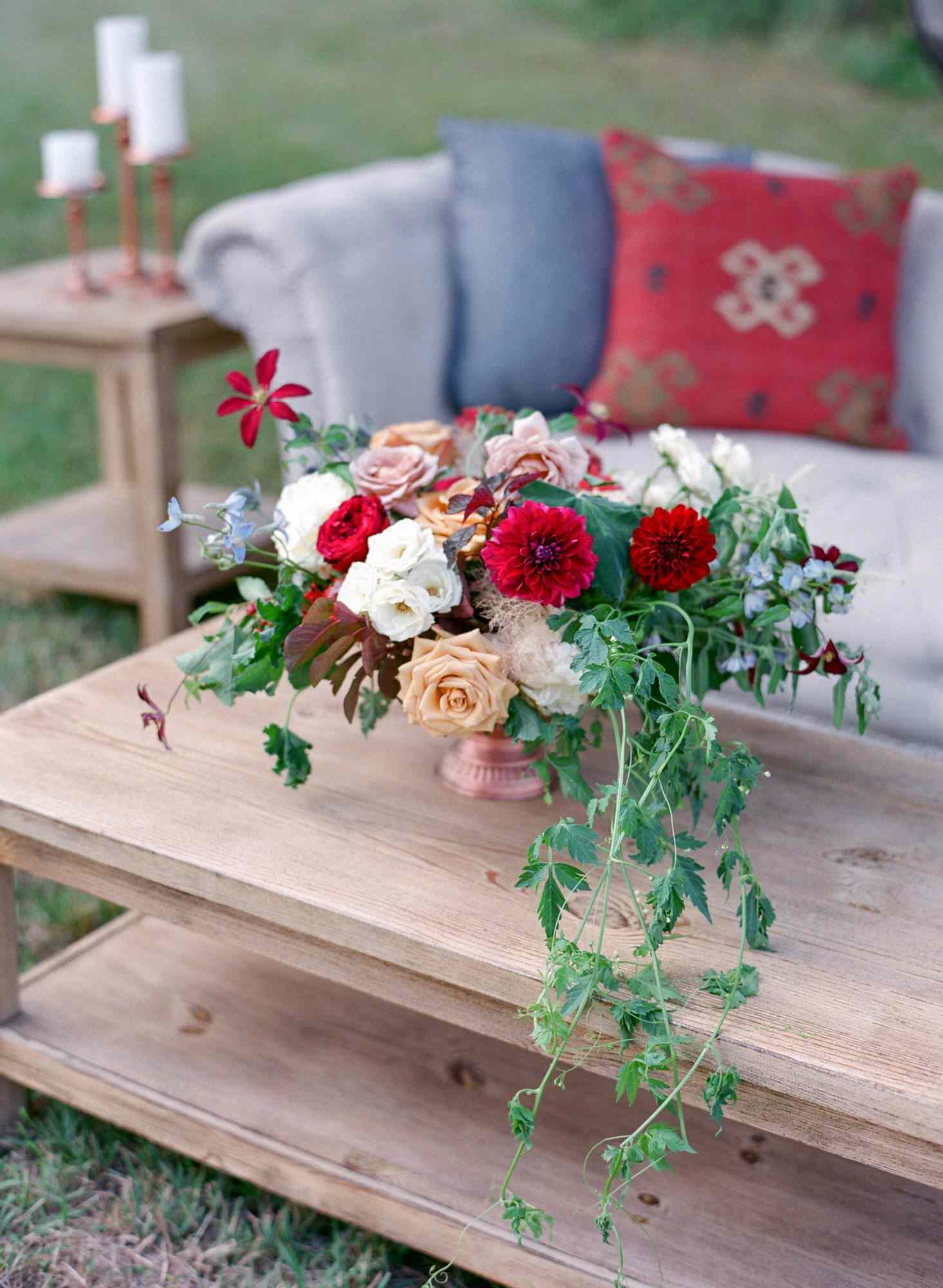 wedding lounge area flowers couch pillows