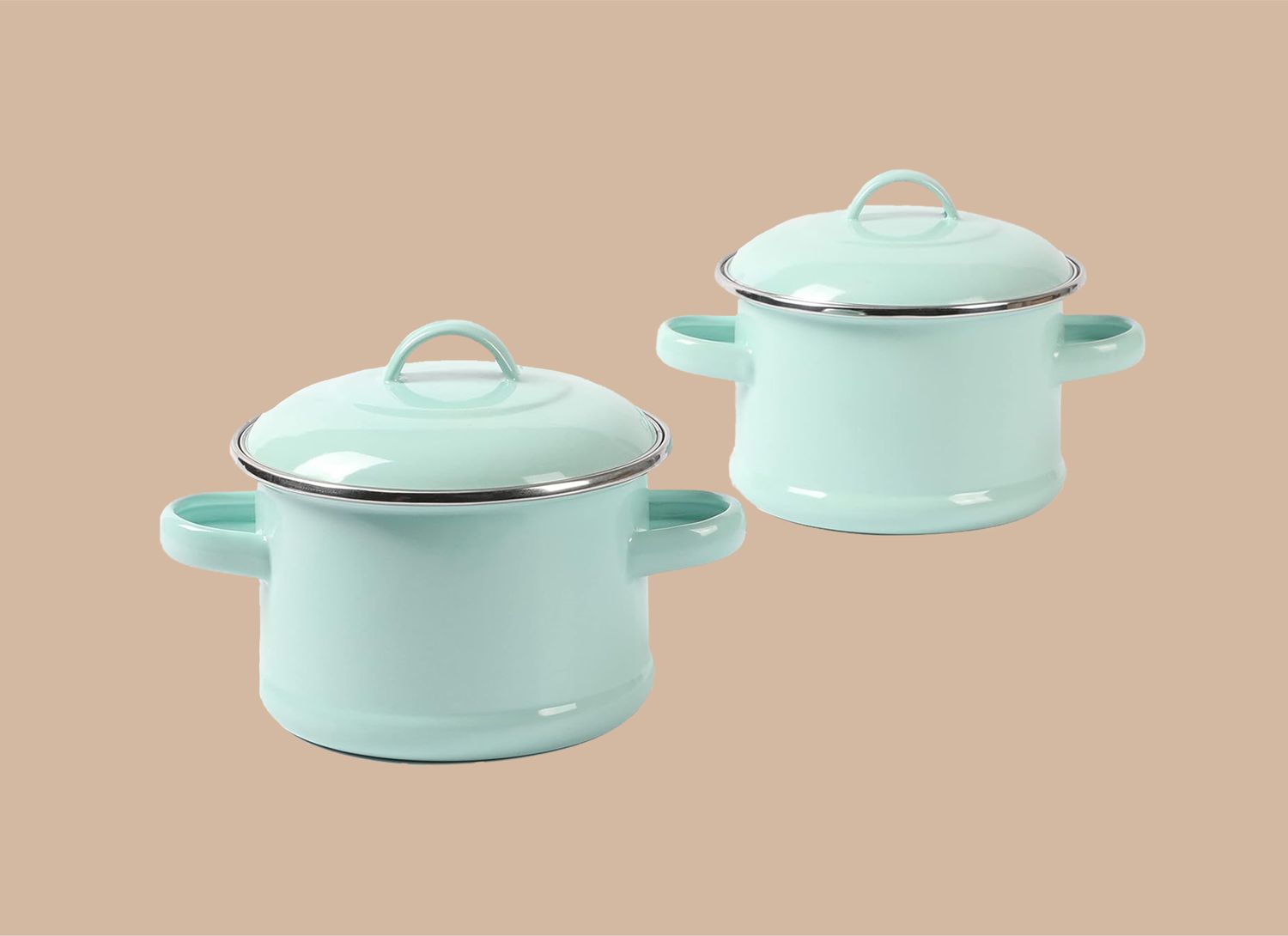 two light teal mini dutch ovens on a tan background