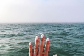 engagement ring selfie seascape