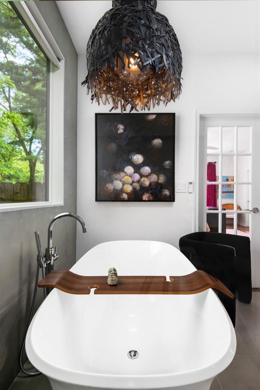 Bathroom with unique light fixture