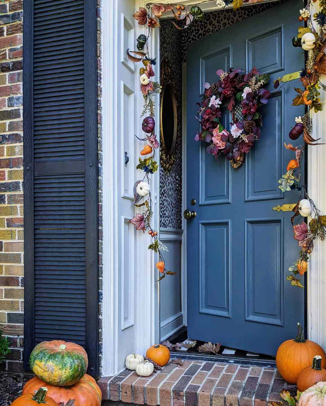 fall porch colorful door garland pumpkins and gourds