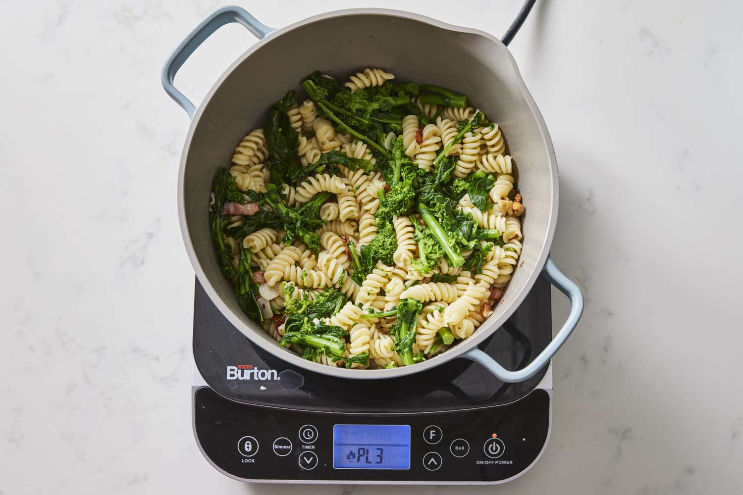 Pasta, broccoli rabe, bacon in pot
