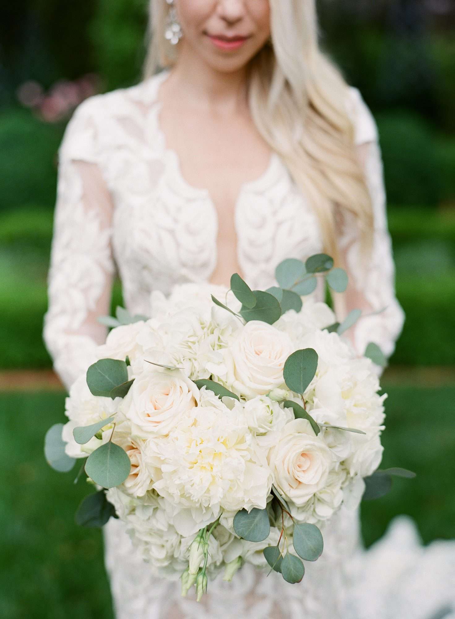 bride with white bouquet