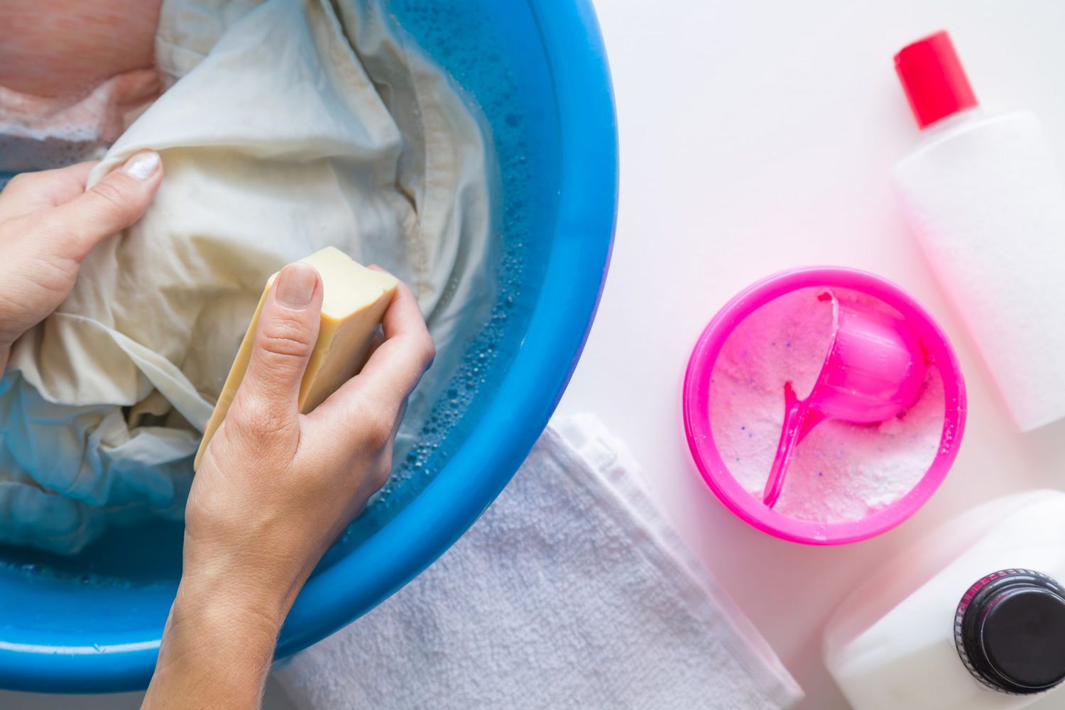 woman removing stain from laundry