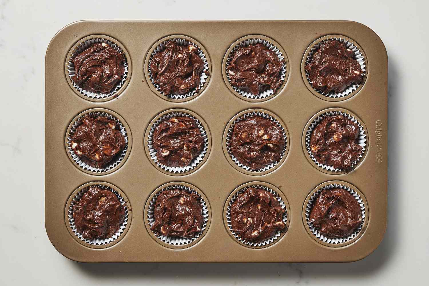 Batter for triple chocolate brownie cups in cupcake pan