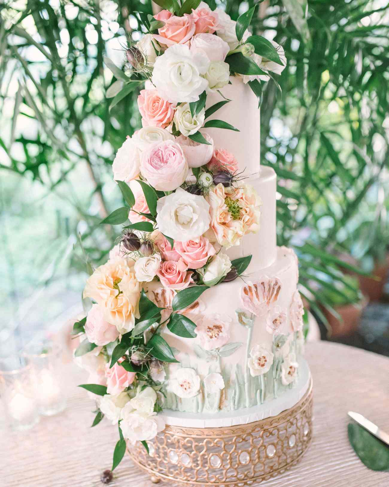 pink white and peach floral covered wedding cake