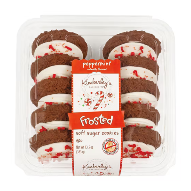 Packaged frosted peppermint soft sugar cookies arranged in a clear plastic container labeled Kimberleys bakery