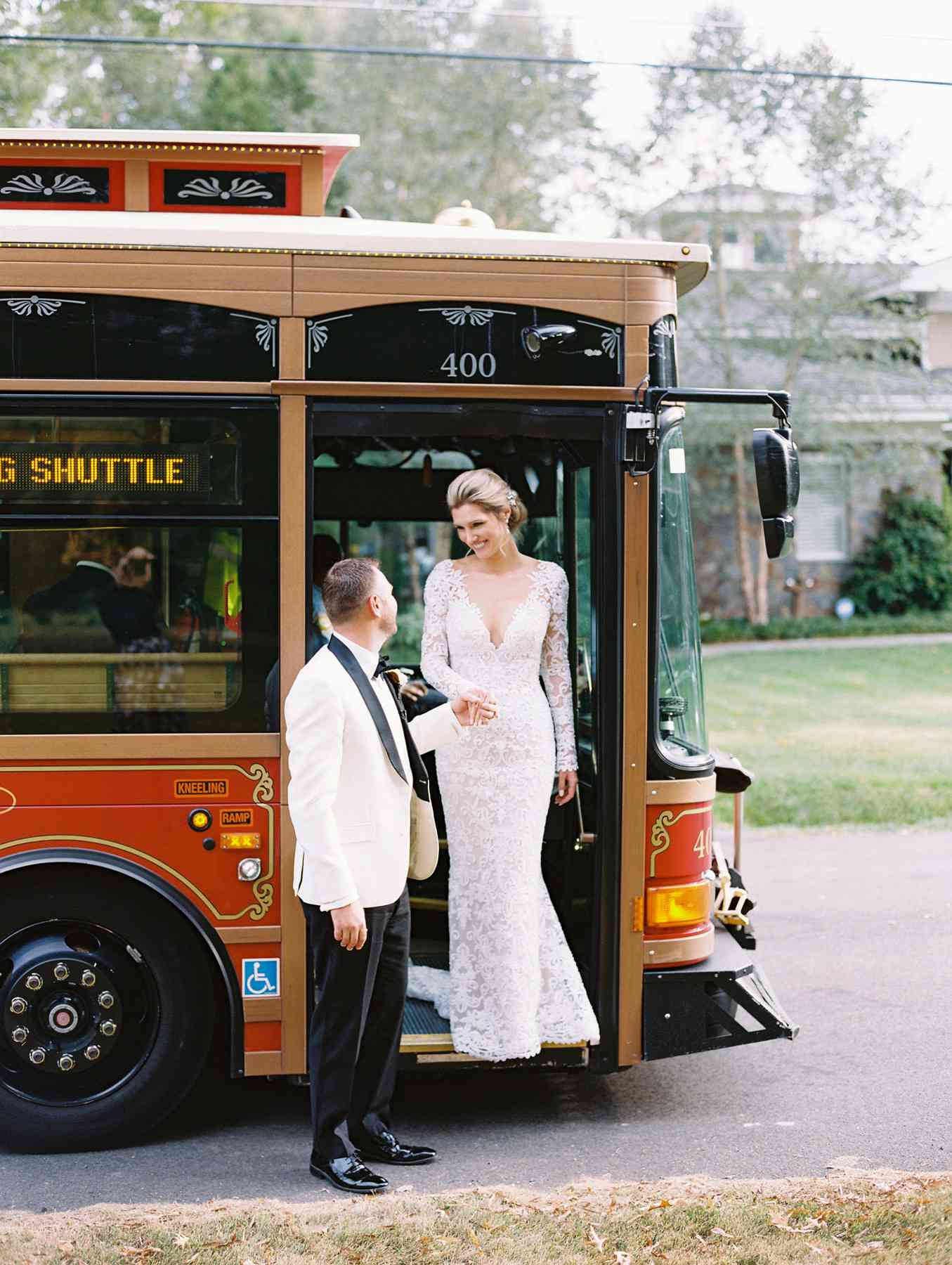 wedding couple getting off trolley