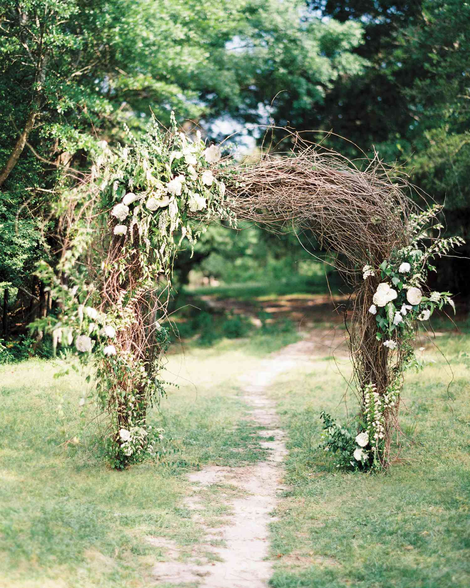 Unkempt Willow Branch Wedding Arch with Pink and Orange Flowers