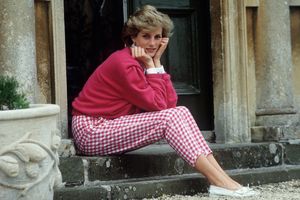 Diana, Princess of Wales, sitting outside a building on stairs