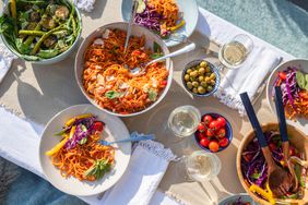 Food on table family style for dinner party outside
