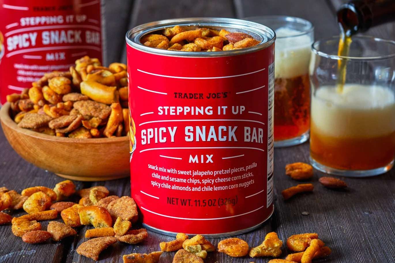 Trader Joes Spicy Snack Bar mix with bowls of snacks and glasses of beer on a table