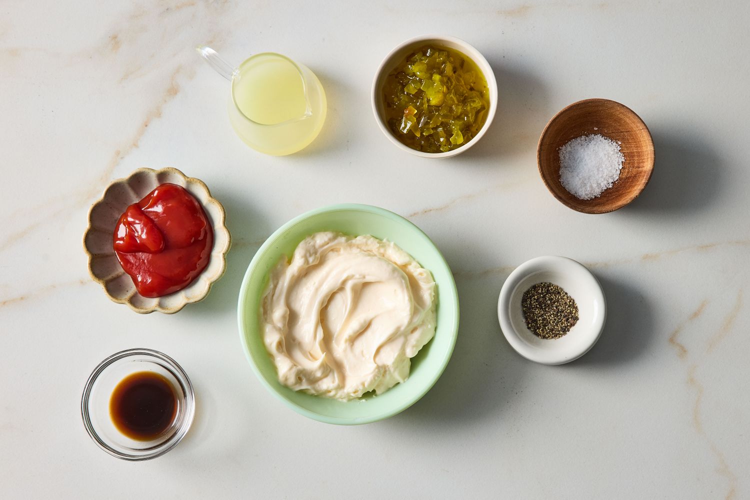 Ingredients for making Russian dressing including mayonnaise ketchup Worcestershire sauce vinegar sweet pickle relish salt and pepper