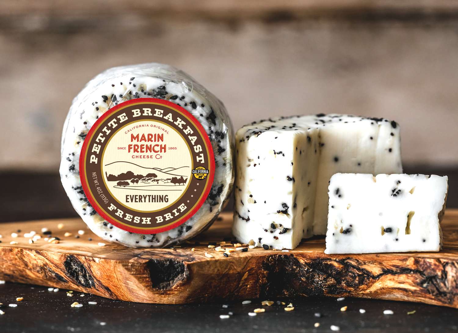 Marin French Everything flavored cheese on a cutting board