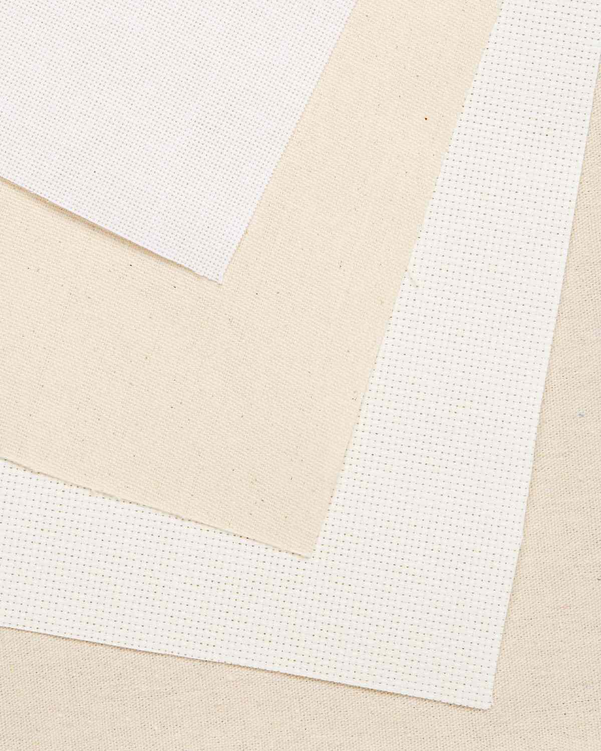 white and tan embroidery fabric