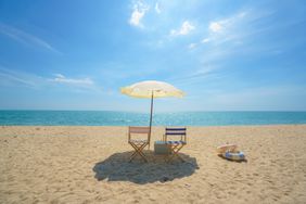 Chairs and umbrella on an empty beach 