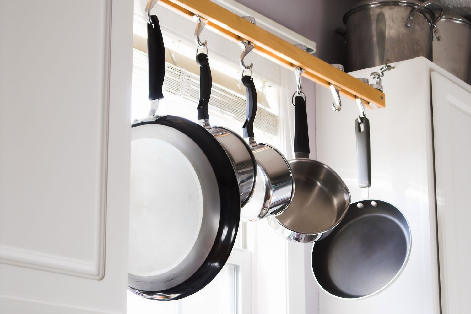 Pots and pans hanging from rack