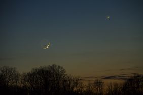 A conjunction of the planets and the moon in a twilight winter sky