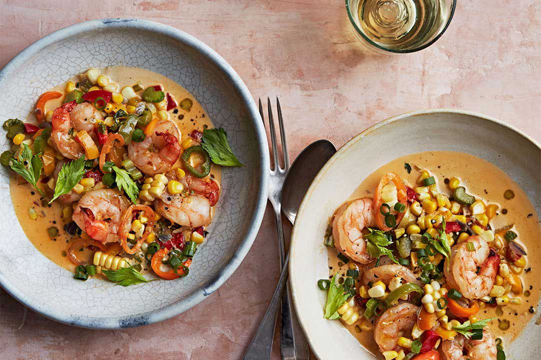 two bowls of shrimp maque choux