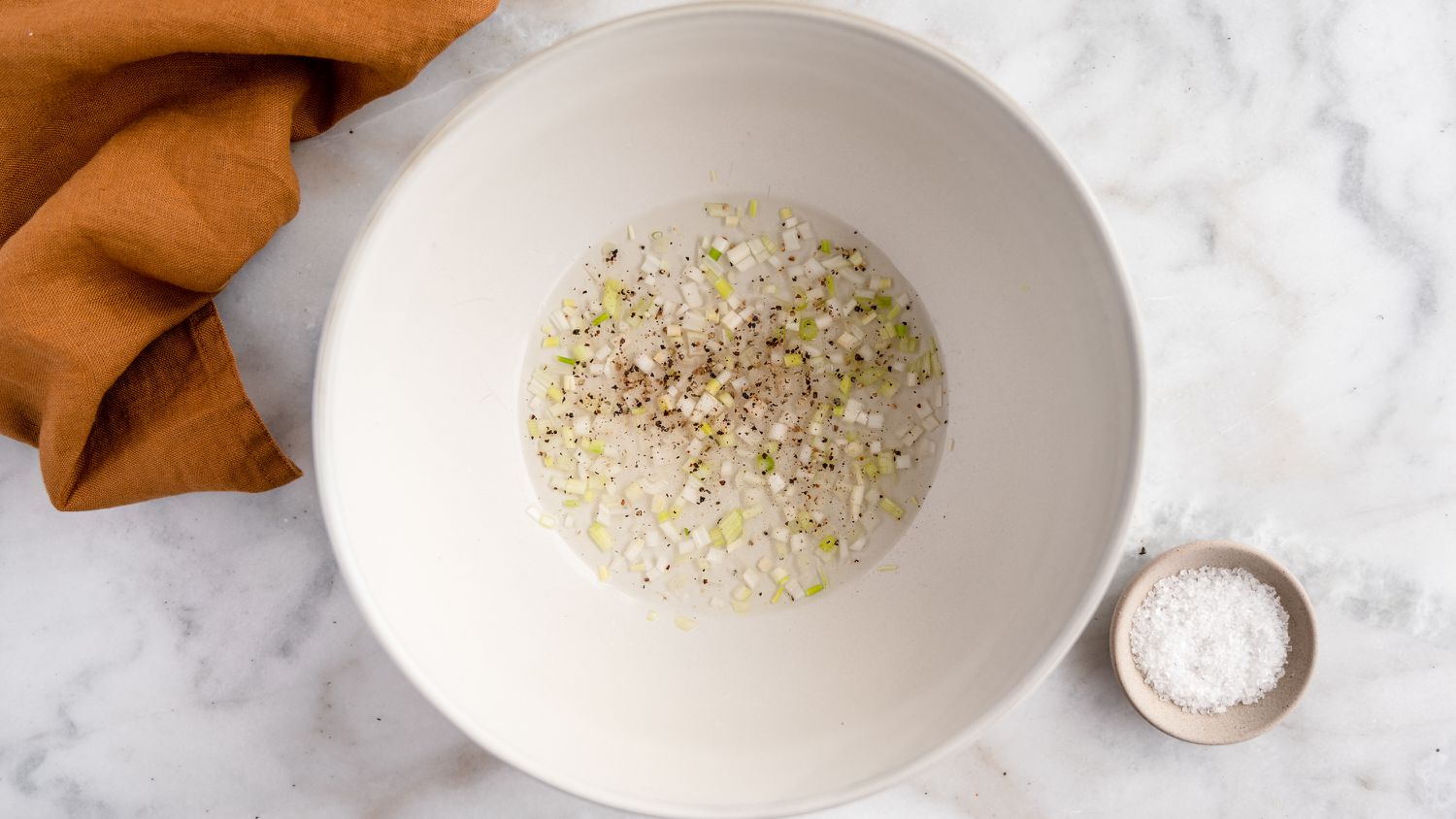 vinegar and scallions in bowl