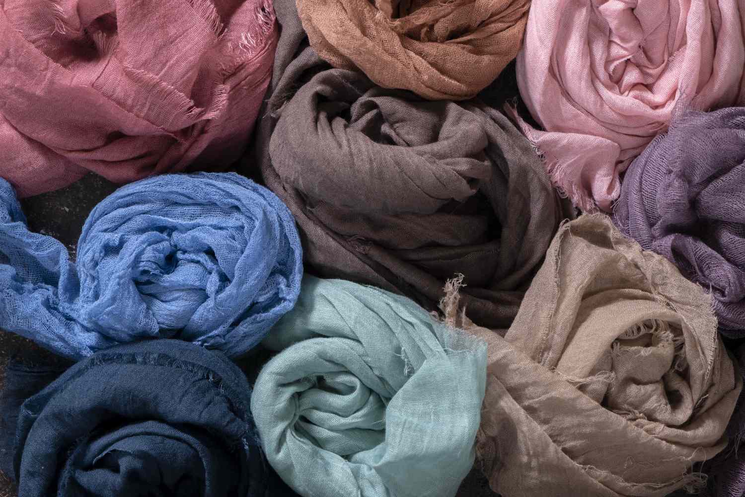 colorful silk scarves rolled up in drawer