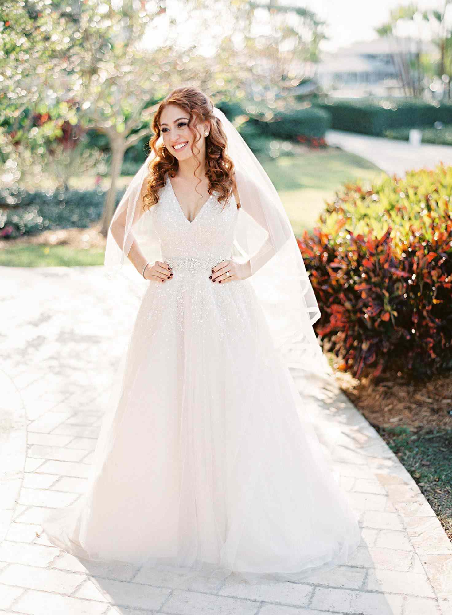 bride with v-neck gown and hair half up half down