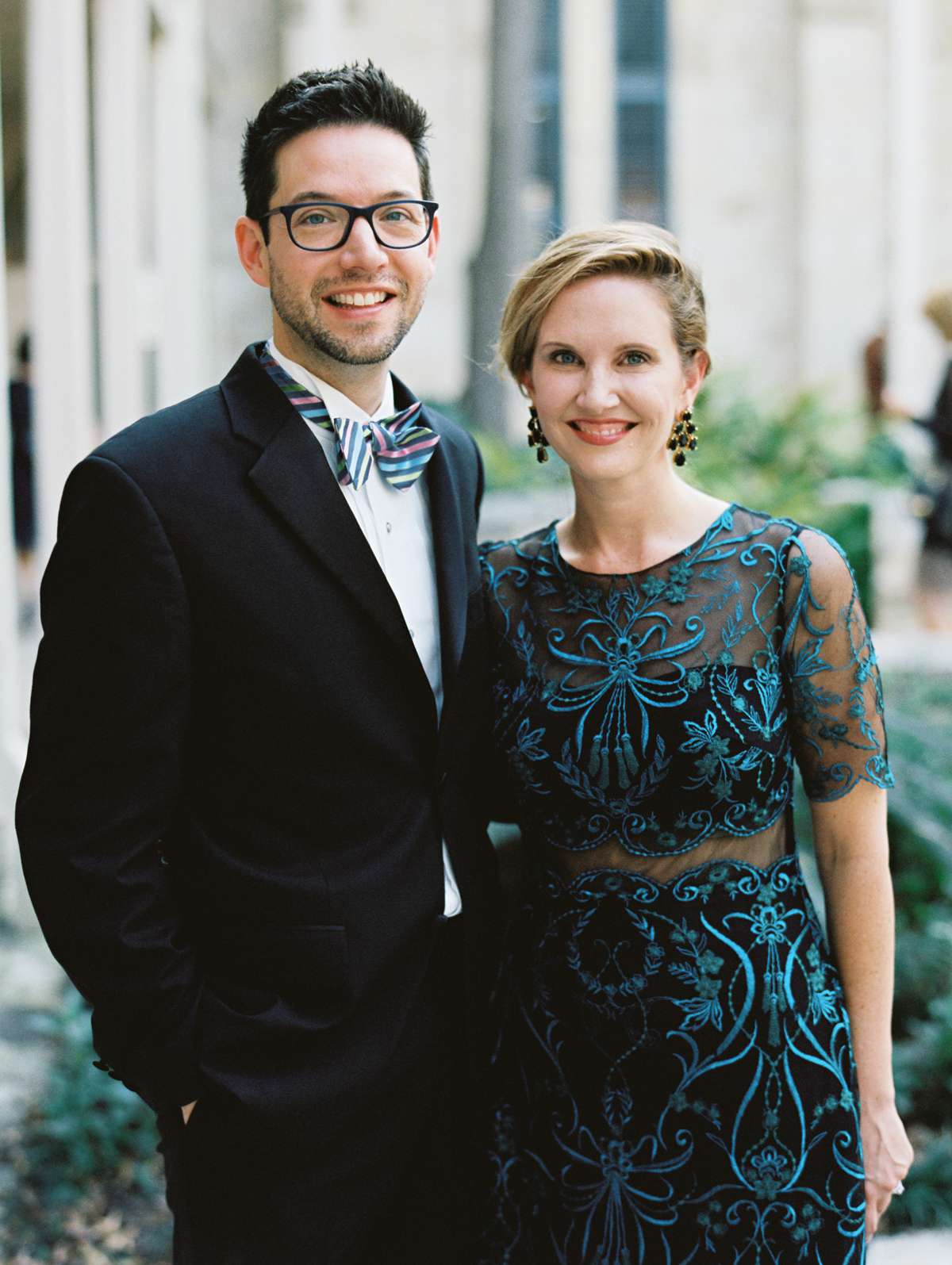 winter wedding guest attire couple woman in festive embroidery