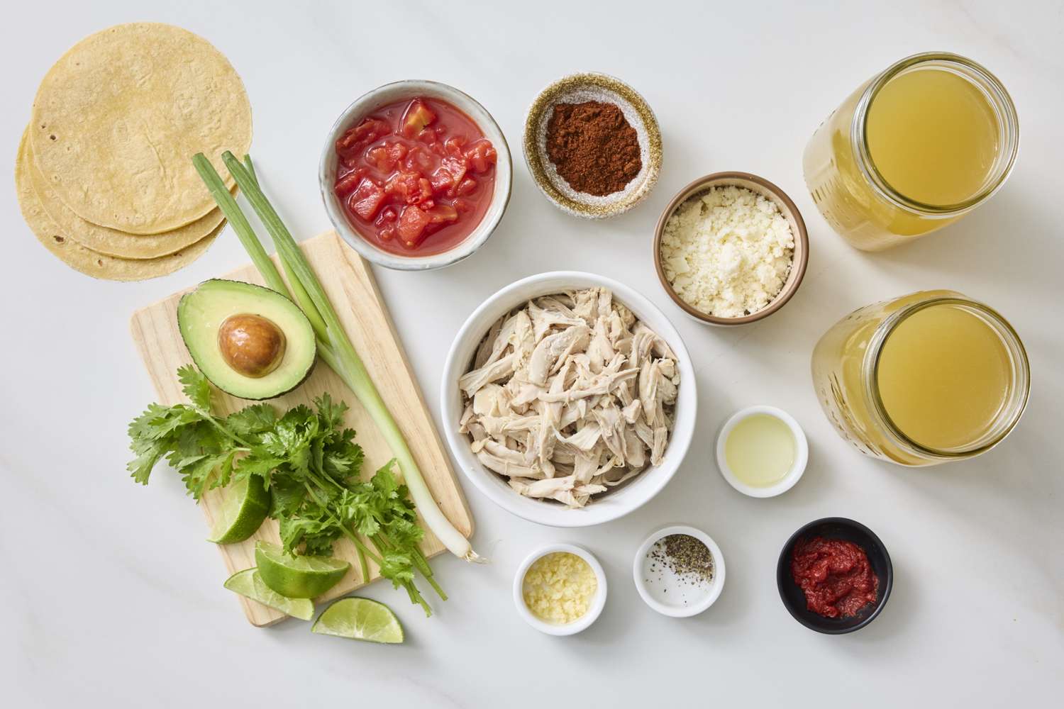Ingredients arranged for making Mexican chicken tortilla soup