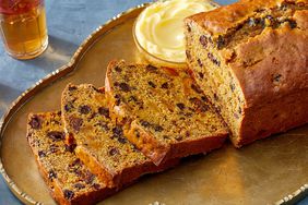 sliced fruit tea cake on golden platter