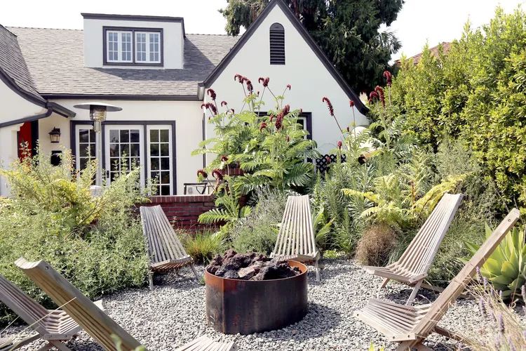 Gravel fire pit and metal barrel