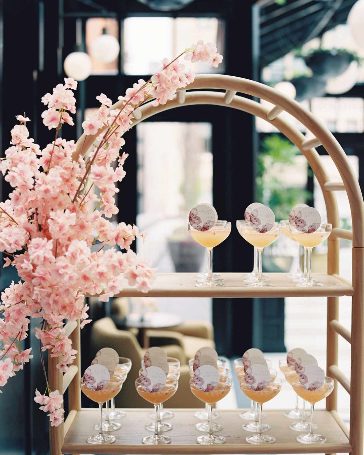 escort cards on cocktails at bridal shower