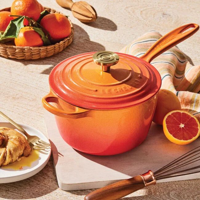  Signature Round Saucepan with Crucible Knob in Flamme Dorée from Le Creuset. 