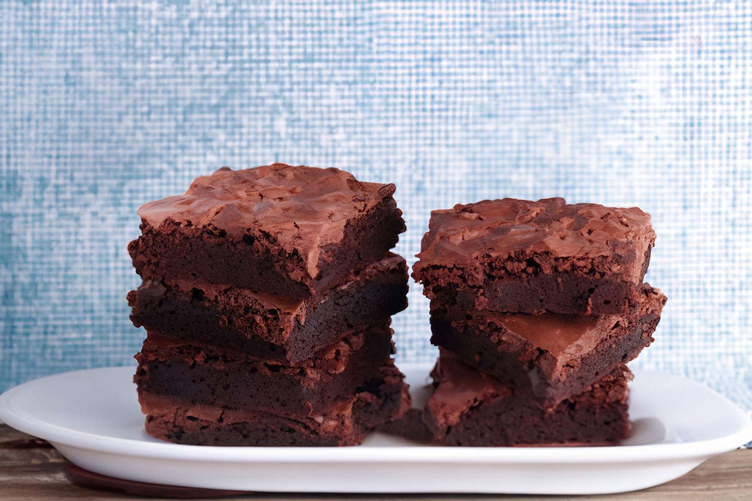 Fudge brownies on white platter