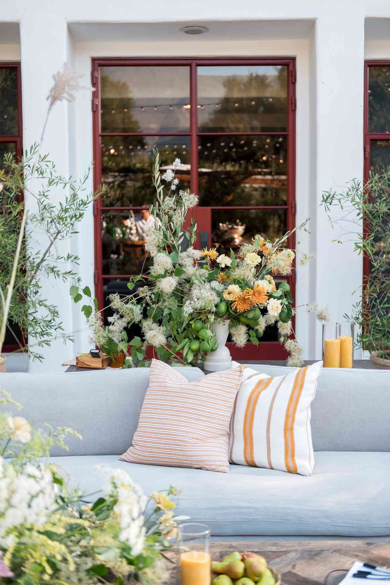 anika max wedding lounge pillows seating with floral arrangements