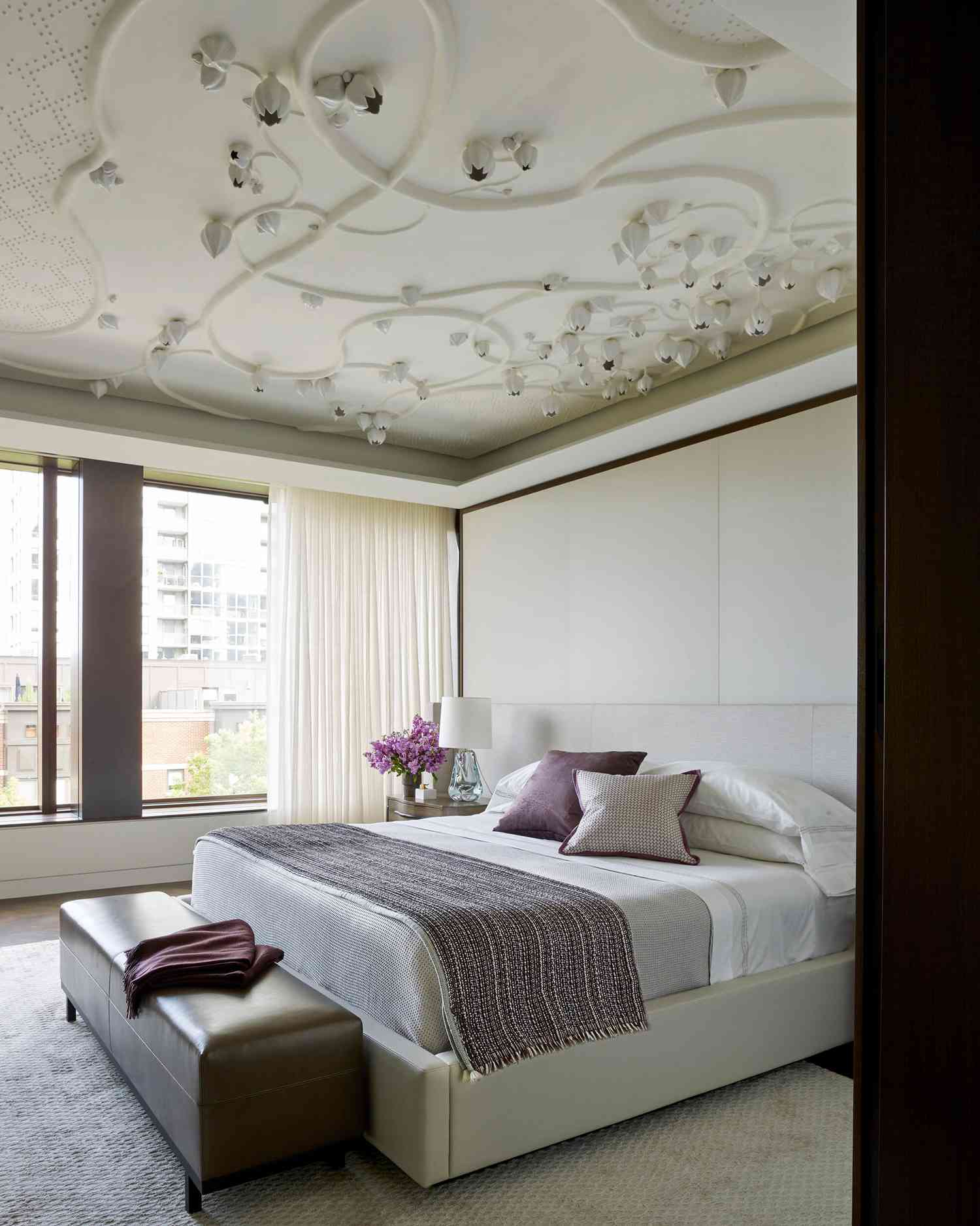 small bedroom with decorative ceiling