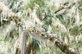 muted blue tulle hanging from tree