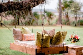 Swinging bench with pillows