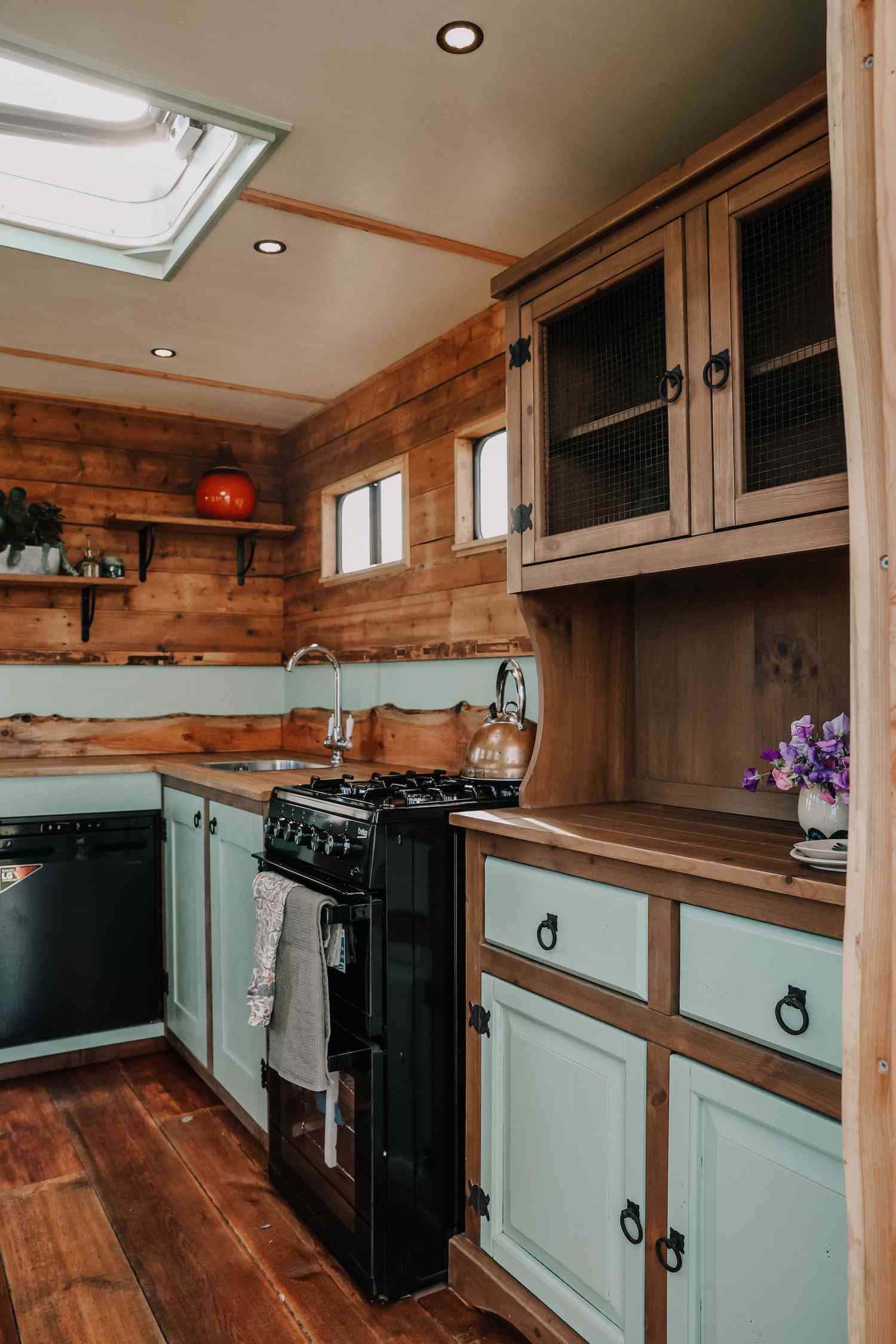 blue and wood tiny home kitchen