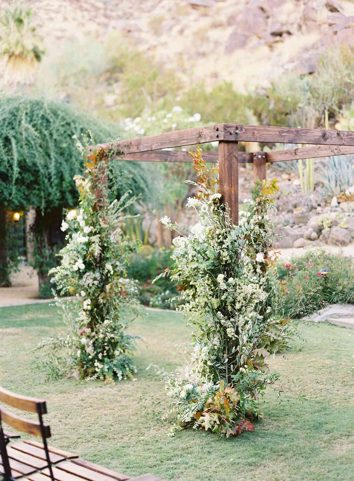 wooden wedding ceremony arch with floral decor