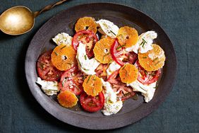 winter caprese salad topped with chives