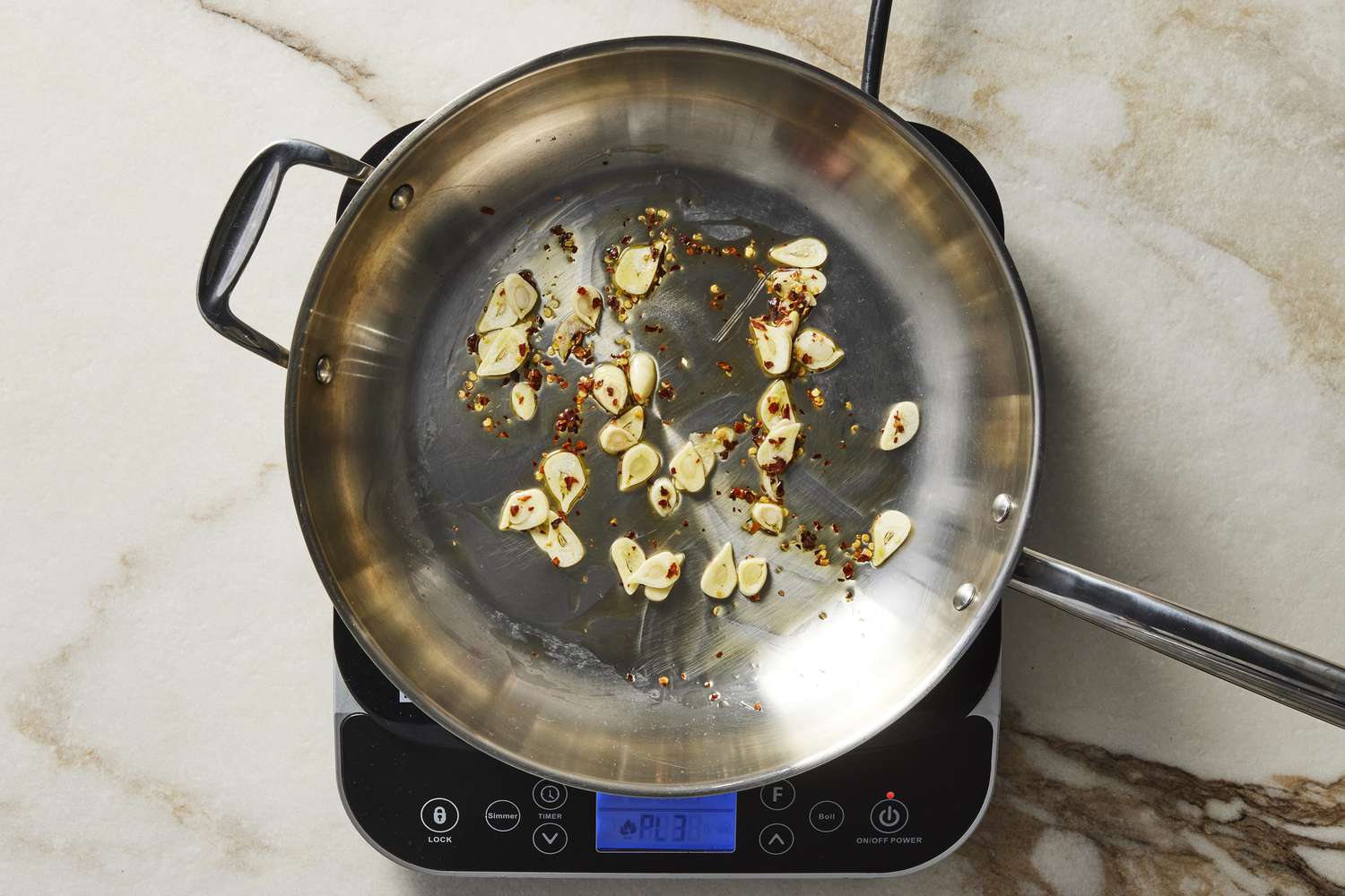 Garlic and red pepper flakes in pan