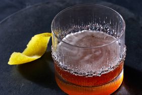 sazerac in rocks glass on black plate